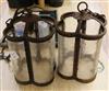 A pair of wrought iron and glass lanterns                                                                                              