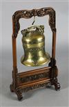 A Chinese Ming bronze bell, 16th/17th century, Height including later wooden 'dragon'' stand 73cm                                      