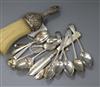 A group of assorted small silver flatware including four spoons by Hester Bateman and a silver mounted brush.                          