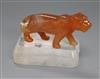 A Chinese chalcedony figure of a tiger with a rock crystal, on stand width 9.5cm                                                       