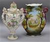 A putti handled lipped flower encrusted Sitzendorf style vase and a two handled pastoral scene vase tallest 36cm                       