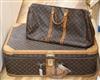 A Louis Vuitton suitcase and holdall                                                                                                   