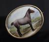 John William Bailey-(active 1860-1910) a gold mounted enamel brooch inset with a portrait of a horse 'Balsam' 42mm.                    