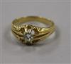 An 18ct gold and claw set solitaire diamond ring, size T.                                                                              