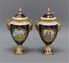 A pair of commemorative Coalport lidded two handled urns height 24cm                                                                   