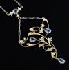 An Edwardian 15ct gold, aquamarine and seed pearl set foliate drop necklace with two colour gold chain,                                