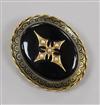 A Victorian yellow metal, black enamel and seed pear set oval mourning brooch, 44mm.                                                   