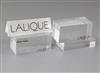 A Lalique perspex display case label and four block base labels, 9.75cm and 8cm.                                                       