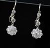 A pair of white gold and diamond flower head cluster drop earrings, 23mm.                                                              