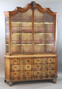 A late 18th century Dutch walnut serpentine vitrine, W.5ft 11in. D.1ft 4in. H.8ft 5in.                                                 