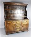 A George III oak dresser, W.5ft 10in. D.1ft 8in. H.6ft 7in.                                                                            