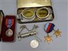 A pair of mid 20th century motorcycle goggles, a Scottish police whistle, three WWII medals and a cased Imperial Service Medal         