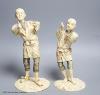 Two Japanese sectional ivory figures of farmers, early 20th century, one signed to base, height 24cm                                                                                                                        