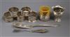 Seven assorted napkin rings including five silver and one French white metal, a small white metal vase and two butter knives.          