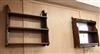A mahogany three tier wall shelf and a mirrored wall shelf W.59cm                                                                      