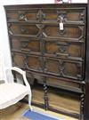 A Jacobean oak tallboy chest of drawers, on stand W.109cm                                                                              