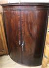 A Regency mahogany bowfront corner cupboard W.99cm                                                                                     