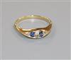 An Edwardian 18ct gold, sapphire and diamond six stone ring, size V.                                                                   