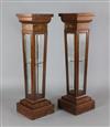 A pair of Edwardian marquetry inlaid rosewood display pedestals, W.1ft D.1ft H.3ft 11in.                                               