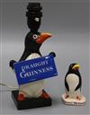 A Carlton ware Guinness advertising penguin lamp base and a similar figure lamp height 24cm                                            