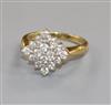 A modern 18ct gold and diamond cluster ring, size M.                                                                                   