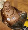 A Chinese painted wood figure of Budha and a scroll H.30cm.                                                                            