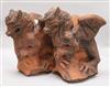 A pair of moulded terracotta griffins H.30cm x W.28cm                                                                                  