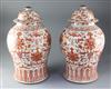 A pair of large Chinese iron red and gilt decorated baluster jars and cover, 19th century, height 43cm, chips to finials on covers     