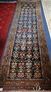 A North West Persian black ground runner 310 x 90cm                                                                                    