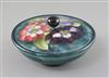 A Moorcroft 'clematis' powder bowl and cover, 1930/40's, diameter 16.2cm                                                               