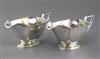 A pair of George V silver sauceboats by Barker Brothers Silver Ltd, 15.5 oz.                                                           