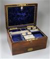 A Victorian travelling rosewood toilet box with seven silver mounted jars, London, 1871 and one other odd jar, box 33cm.               