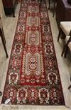 A Persian red ground runner 340 x 80cm                                                                                                 