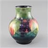 A Moorcroft 'leaf and berry' baluster vase, 1950's, H.19.5cm                                                                           