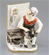 A Rockingham porcelain figure of a seated cobbler, c.1830, H.14cm, left arm re-stuck at shoulder                                       