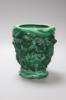 A Czech malachite glass vase with cherubs designed for Schlevogt, c.1920, height 19cm                                                                                                                                       