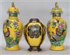 A pair of Carlton ware yellow ground vases and covers and a similar jar                                                                