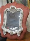 A German porcelain mirror length 67cm approx.                                                                                          