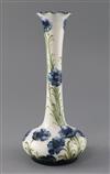 A Moorcroft Florian ware 'blue poppy' vase, Rd. no. for 1902, H.24.2cm, crack to edge of foot                                          