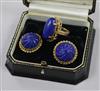 A yellow metal and lapis lazuli oval dress ring and a pair of 9ct gold and lapis lazuli earclips.                                      