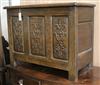 An early 18th century oak coffer, with later carving W.79cm                                                                            