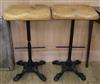 A pair of cast iron base stools with oak tops W.44cm                                                                                   
