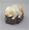 An unusual Chinese pale celadon and russet skin jade 'lion-dog' snuff bottle, 19th century, length 5cm excl. wood stand                