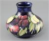 A Moorcroft 'wisteria' squat baluster vase, c.1920-5, H.16cm                                                                           