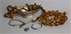 An Art Deco silver bowl, spoon, bracelet, bangle and medallion and two amber necklaces                                                 