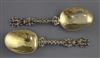 A pair 19th century continental silver gilt spoons with figural terminals, 17.6cm.                                                     