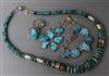 A group of assorted turquoise set jewellery comprising two rings, a bracelet and two necklaces.                                        
