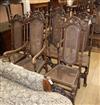 A set of eight William and Mary style oak, beech and canework high back dining chairs, two with arms                                   