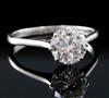 A platinum and solitaire diamond ring, size S.                                                                                         