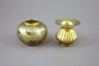 A Tiffany vine leaf pattern favrile iridescent glass vase and a Tiffany favrile lobed vase, early 20th century,                        